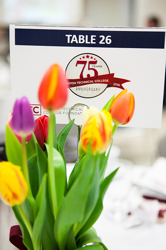 Photo of tulips and 75th Anniversary table sign.