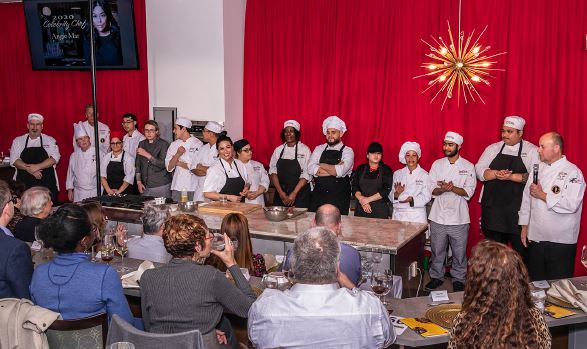 Celebrity chef dinner guests applaud Angie Mar and RTC students