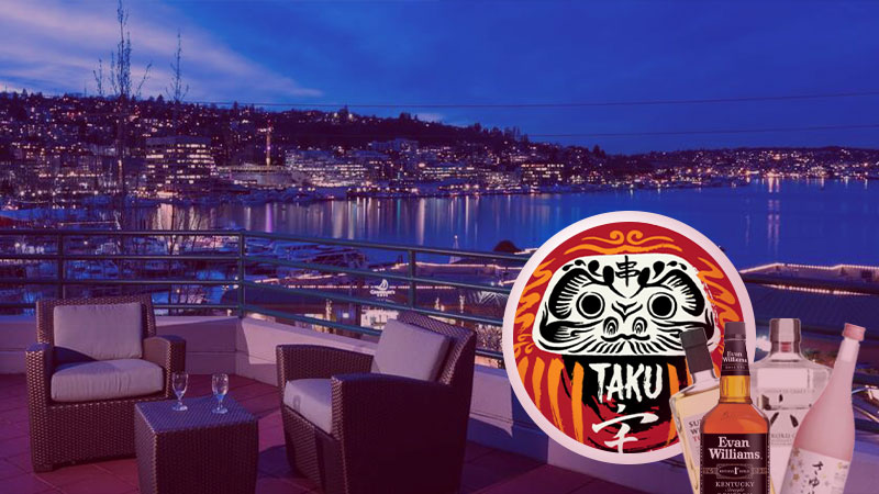 hotel balcony showing Seattle, Taku logo, and various bottles of wine on the lower right corner