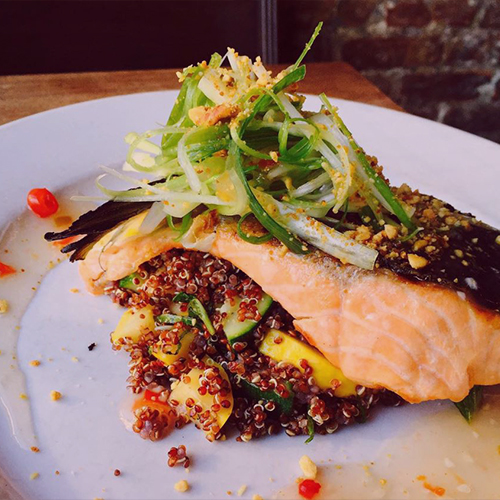 coocked salmon with quinoa on a plate