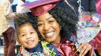 Graduation photo of mom and her daughter.
